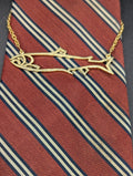18K yellow Gold salmon tie bar with safety chain
